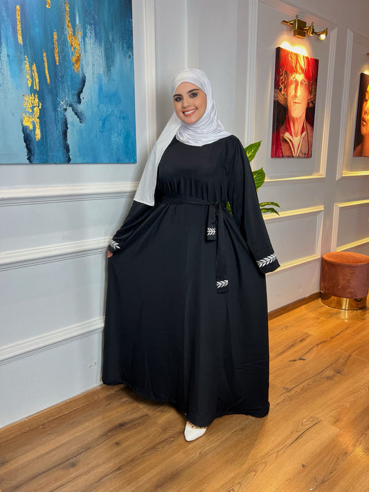 كسوة بالطّرزة والحزام